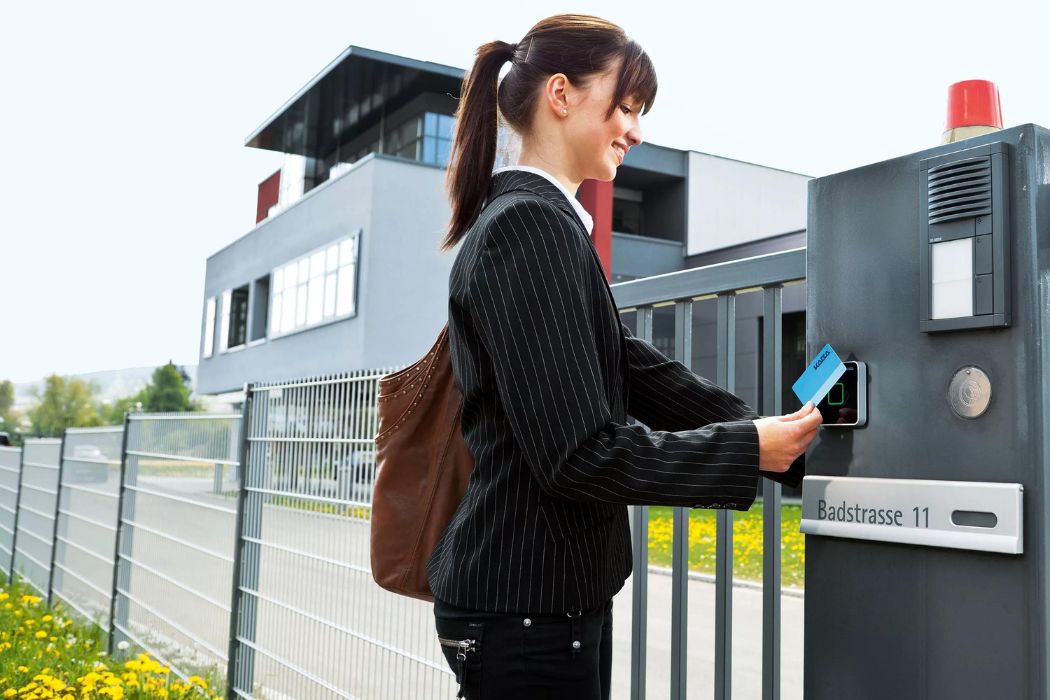 A woman dressed in a business suit utilizes a access control security