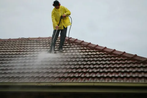 Have you noticed green patches spreading on your roof? That's moss, and it's more than just an eyesore. Moss can damage your roof by retaining moisture, leading to costly repairs. However, with top-rated pressure washing in Allen Park MI, you can remove moss effectively. This post will guide you through the steps to achieve a clean, moss-free roof. Preparing Your Roof For Top-Rated Pressure Washing In Allen Park MI Before you start, it's crucial to take the right safety precautions. Therefore, safety first! Then, inspect your roof for any damaged tiles or shingles. Address these issues to avoid complications during the cleaning process. Thus, protect your plants and landscaping by covering them with tarps, as runoff from cleaning solutions can harm them. Further, ensure your gutters are clear to prevent water from pooling during cleaning. Hence, a little prep goes a long way in protecting your property. The Right Way to Pressure Wash Choosing the right pressure washer is key. For roofing, a washer with 1200 to 1500 psi is sufficient. Using a washer with too much power can damage your shingles. Thus, choosing the right tool for the job is critical. Start by applying a moss-killing detergent to your roof. Let it sit for about 15-20 minutes. This step helps loosen the moss and makes removal easier. Therefore, it's an essential part of the process. Afterward, use the pressure washer at a downward angle to avoid lifting shingles. Moreover, keep the nozzle moving to prevent concentrated water from damaging your roof. Maintaining a Moss-Free Roof After cleaning, taking preventive measures to keep moss from returning is wise. Moss prefers moisture, so keeping your roof dry is crucial. If you want to dry your roof faster and ensure sunlight reaches all areas, trim any branches hanging over it. In addition, you might want to think about putting some copper or zinc strips on your roof's peak. Rainfall containing these metals releases particles that impede moss growth. Furthermore, regular maintenance, like gutter cleaning and periodic inspections, can prevent moss from returning. Hence, a little upkeep goes a long way in keeping your roof in top condition. Understand the Moss Menace Moss thrives in damp, shaded areas, making your roof an ideal spot for growth, especially after a rainy season. Its ability to soak up water means it can hasten the deterioration of roofing materials and reduce their useful life. Thus, removing moss is crucial to the structural integrity of your home and goes beyond mere aesthetics. Moss removal also improves the aesthetics of your home and may even raise its value. Hence, tackling this problem is a smart move. But remember, while you might be tempted to scrape or pull moss away, these methods can harm your roof. Thus, expert pressure washing in Allen Park MI, is a safer alternative. Safety Tips for Pressure Washing Safety cannot be overstressed when working on your roof. Always use a harness and ensure your ladder is secure. Further, wearing gloves and goggles protects you from debris and chemicals. Moreover, never work alone. Having someone to help can prevent accidents. Thus, prioritizing your safety helps ensure the cleaning process is effective and accident-free. Choose the Right Season for Cleaning Timing is crucial when it comes to pressure washing your roof. You want to ensure your roof is dry enough to handle the pressure washing. Therefore, late spring or early fall are ideal. These seasons usually provide mild weather. Allen Park pressure washing makes it easier to work safely on your roof. Moreover, cleaning during these times prepares your roof for the upcoming weather extremes of summer and winter. Hence, planning your cleaning schedule can significantly impact the effectiveness of your efforts. The Environmental Impact of Moss Removal Consider the environment when removing moss from your roof. Use biodegradable, eco-friendly cleaning solutions. These products are just as effective but less harmful to your surroundings. Therefore, you avoid polluting your garden or harming wildlife. Further, these solutions are often safer for your roofing materials. Thus, choosing environmentally friendly products benefits your home and the planet. Aftercare and Prevention Techniques After cleaning your roof and applying a moss-preventative treatment, it's essential to adopt ongoing maintenance practices to inhibit moss regrowth. Hence, the pressure washer service near me is crucial in early detection, allowing prompt intervention before moss issues escalate. Reduce the likelihood of moss growth by enhancing roof drainage and cutting down on shaded areas. Taking these preventative measures will not only make your roof look better, but it will also last longer and require less care in the long run. Implementing these preventive measures ensures your roof remains in optimal condition year-round, reducing the need for frequent cleaning and repairs. When to Call a Professional Steep roofs or extensive moss infestations pose safety risks and require specialized tools and techniques for effective removal. Professional roofers ensure safe moss removal and conduct thorough inspections to identify underlying issues like damaged shingles or compromised structural integrity. The job will be done efficiently with the help of professionals, reducing the chances of accidents or incomplete moss eradication. To top it all off, experts can provide you peace of mind by recommending long-term maintenance techniques customized to your roof's unique requirements. This will ensure that your home's roofing system remains intact for many years. Conclusion: In conclusion, pressure washing is an effective method to remove moss from your roof. However, it requires careful handling and preparation. By opting for top-rated pressure washing in Allen Park MI, you can extend the life of your roof and keep your home looking its best. Keeping your roof clean is nice to look at and an important part of keeping your home in good shape.